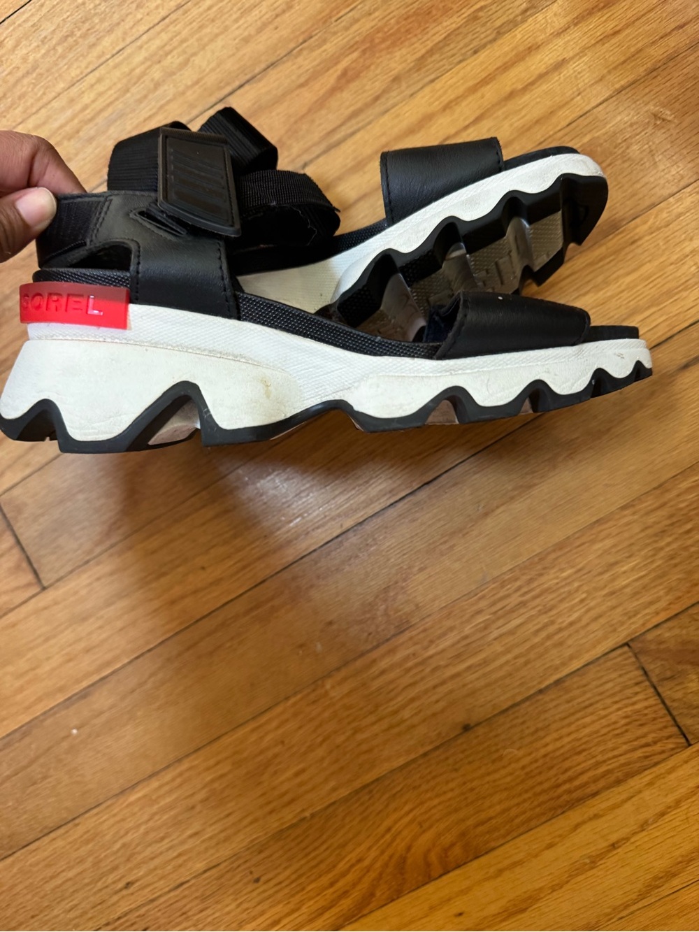 Sorel KBlack Sandal with White Wave Sole and Red Heel Tab